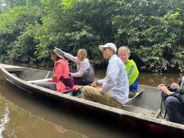 Guest enjoying a riverboat excursion on the Madre de Dios River in the Peruvian Amazon